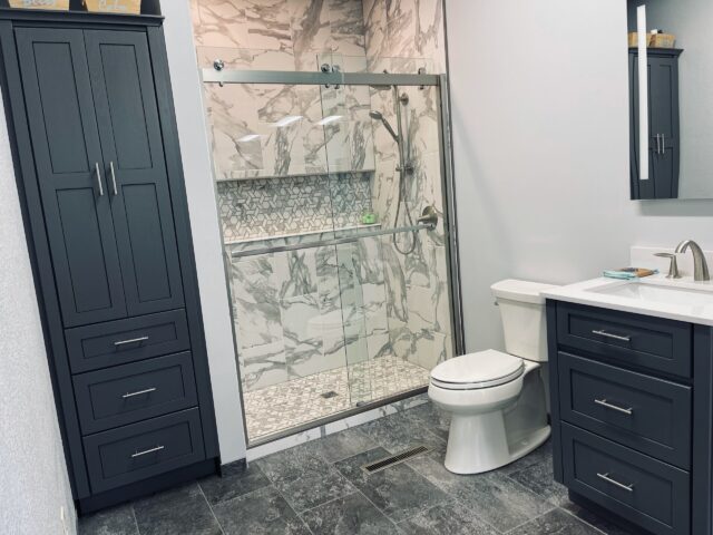 Image of a Farmhouse style bathroom in grey.